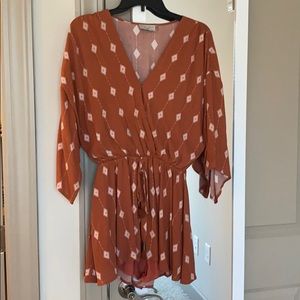 Cute dress forum romper with three quarter sleeve.